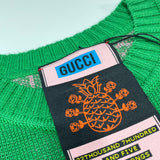 Maglione verde e logo monogramma