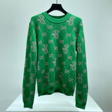 Maglione verde e logo monogramma