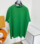 T-shirt con logo centrato verde e nero