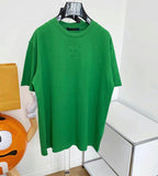 T-shirt con logo centrato verde e nero