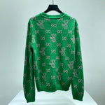 Maglione verde e logo monogramma